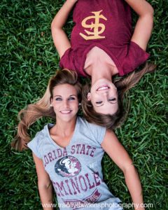 Senior picture with BFF in college shirts