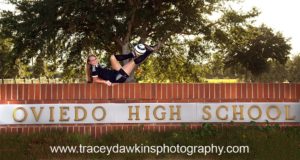 Senior picture on the school sign