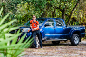 Central Florida Photographer-Senior with his football Jersey and truck.